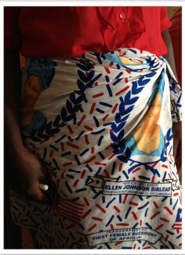 A women with a "Lapa" featuring a print of Ellen Johnson Sirleaf, Liberia's president and the first female president of an African country
